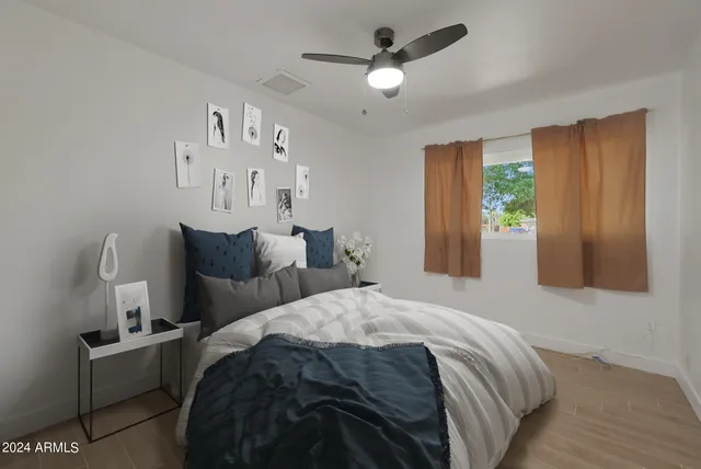 a bedroom with bed and window