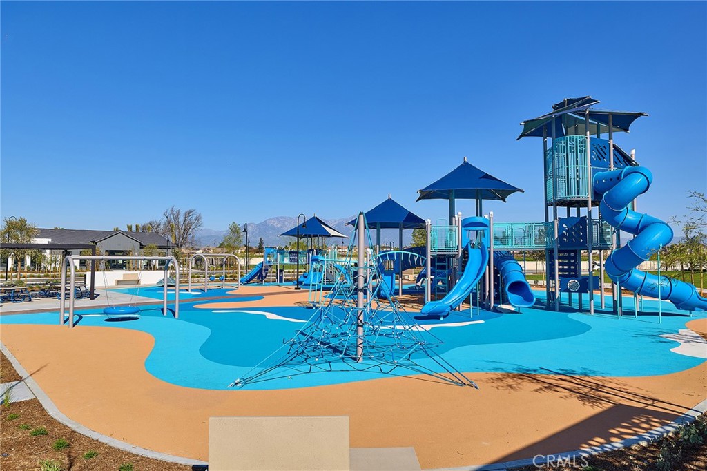 5911 Rockport Road Eastvale, CA 92880 - Photo 34 of 39 a view of a swimming pool with an outdoor space and seating area