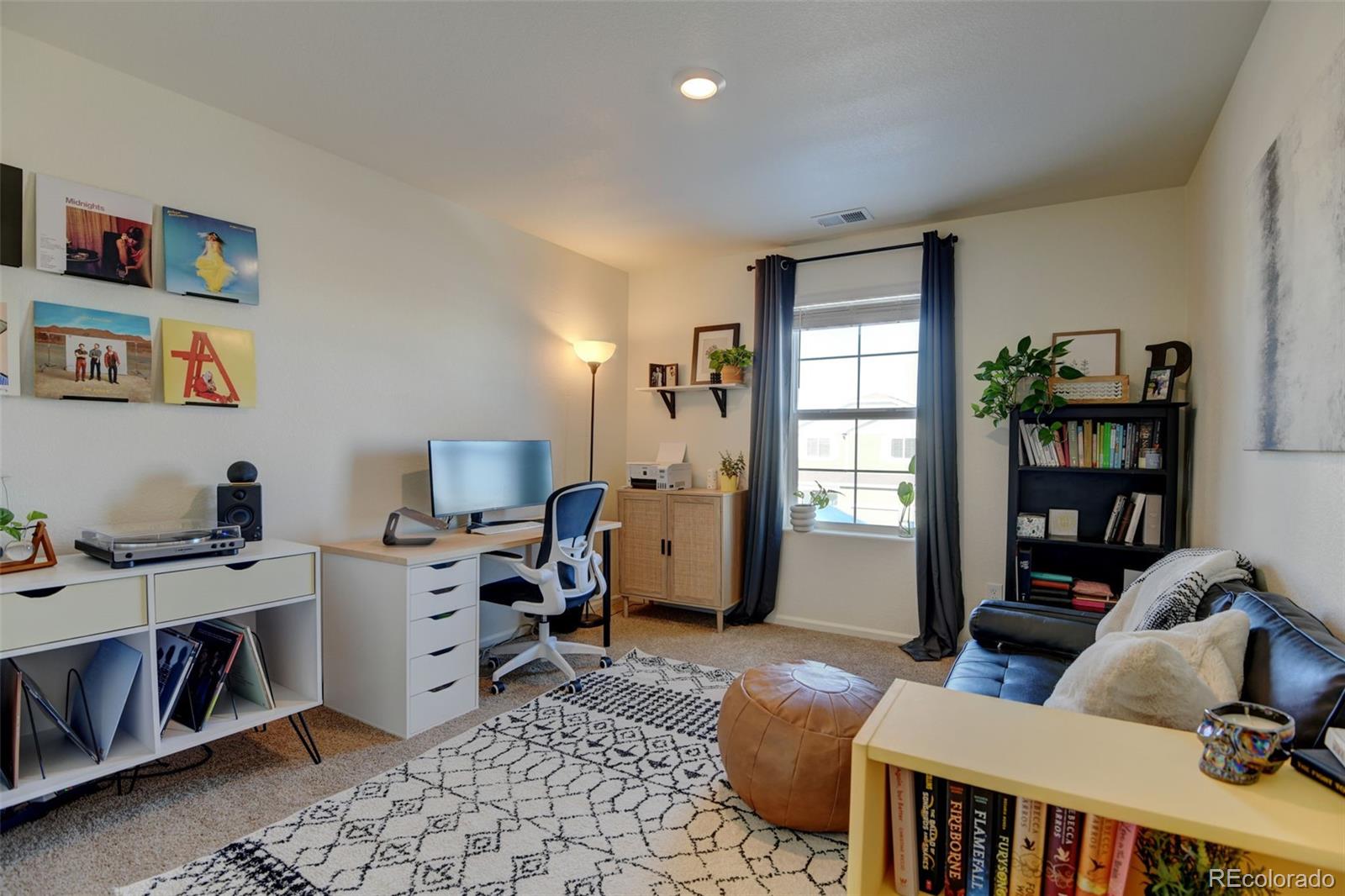 7252 Fall River Circle Frederick, CO 80530 - Photo 20 of 31 a bedroom with furniture and a window