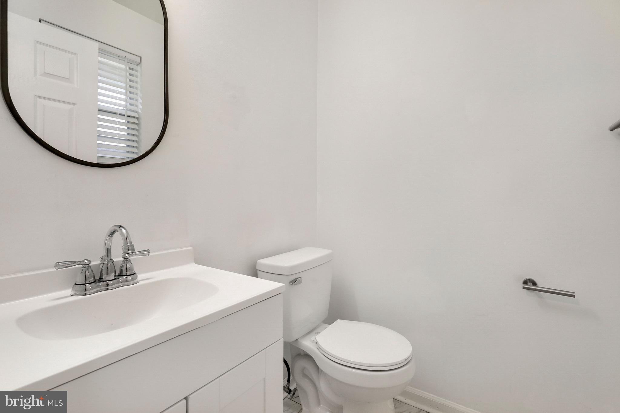 1804 Mason Run Pine Hill, NJ 08021 - Photo 14 of 32 a bathroom with a toilet a sink and a mirror