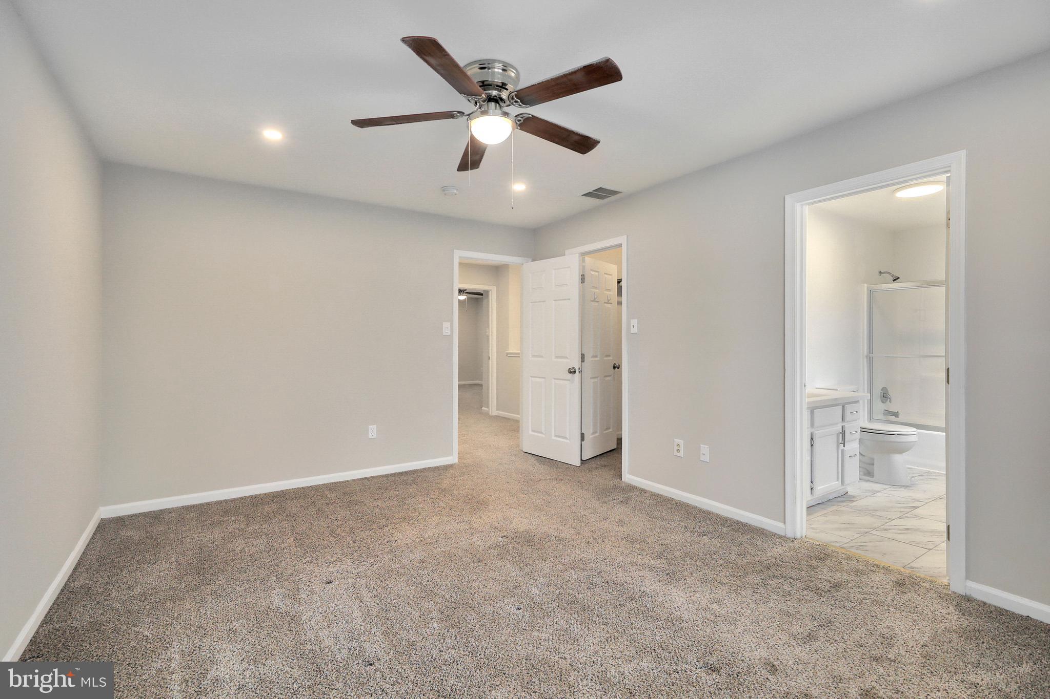1804 Mason Run Pine Hill, NJ 08021 - Photo 17 of 32 an empty room with closet and a ceiling fan