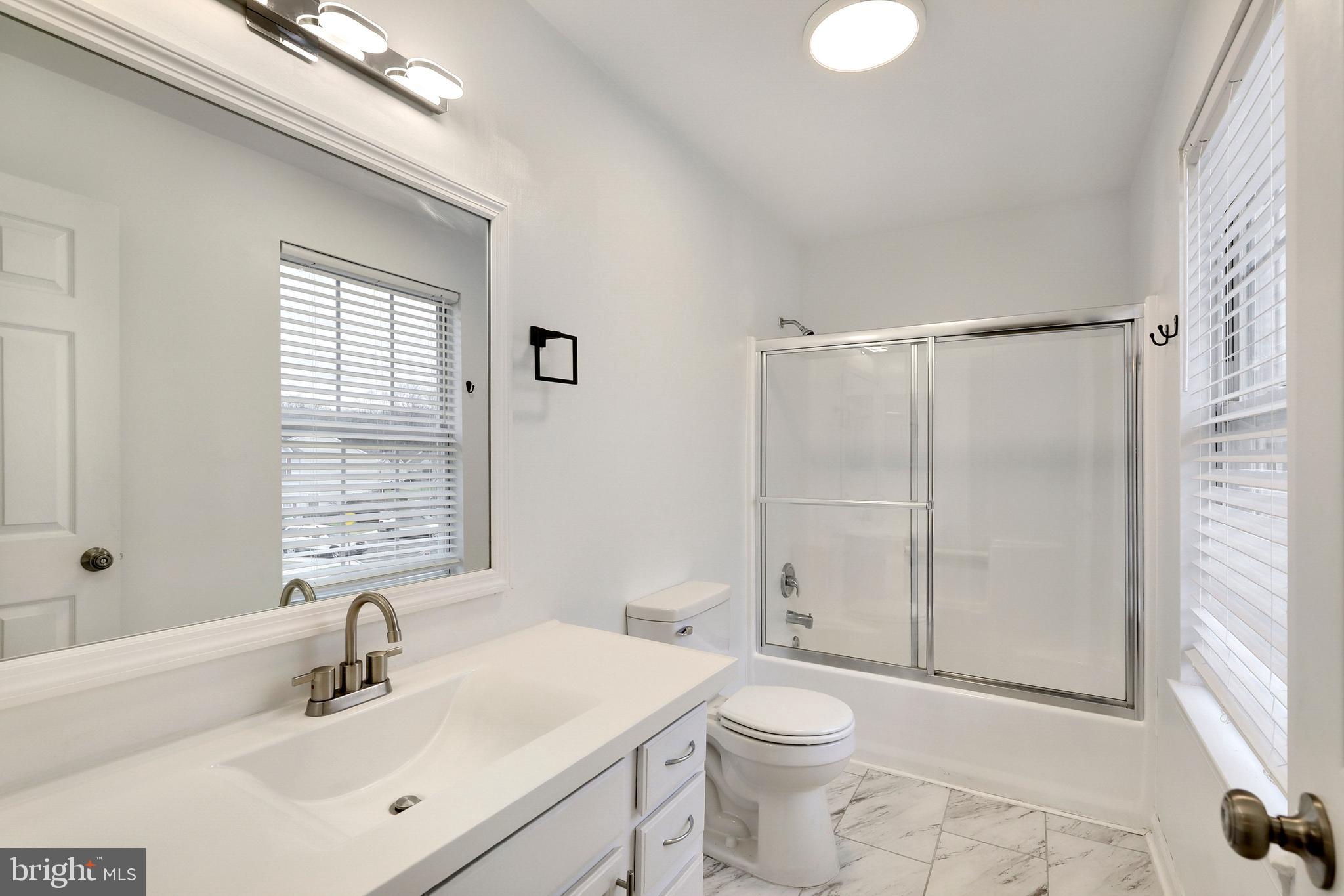 1804 Mason Run Pine Hill, NJ 08021 - Photo 18 of 32 a bathroom with a sink toilet and shower