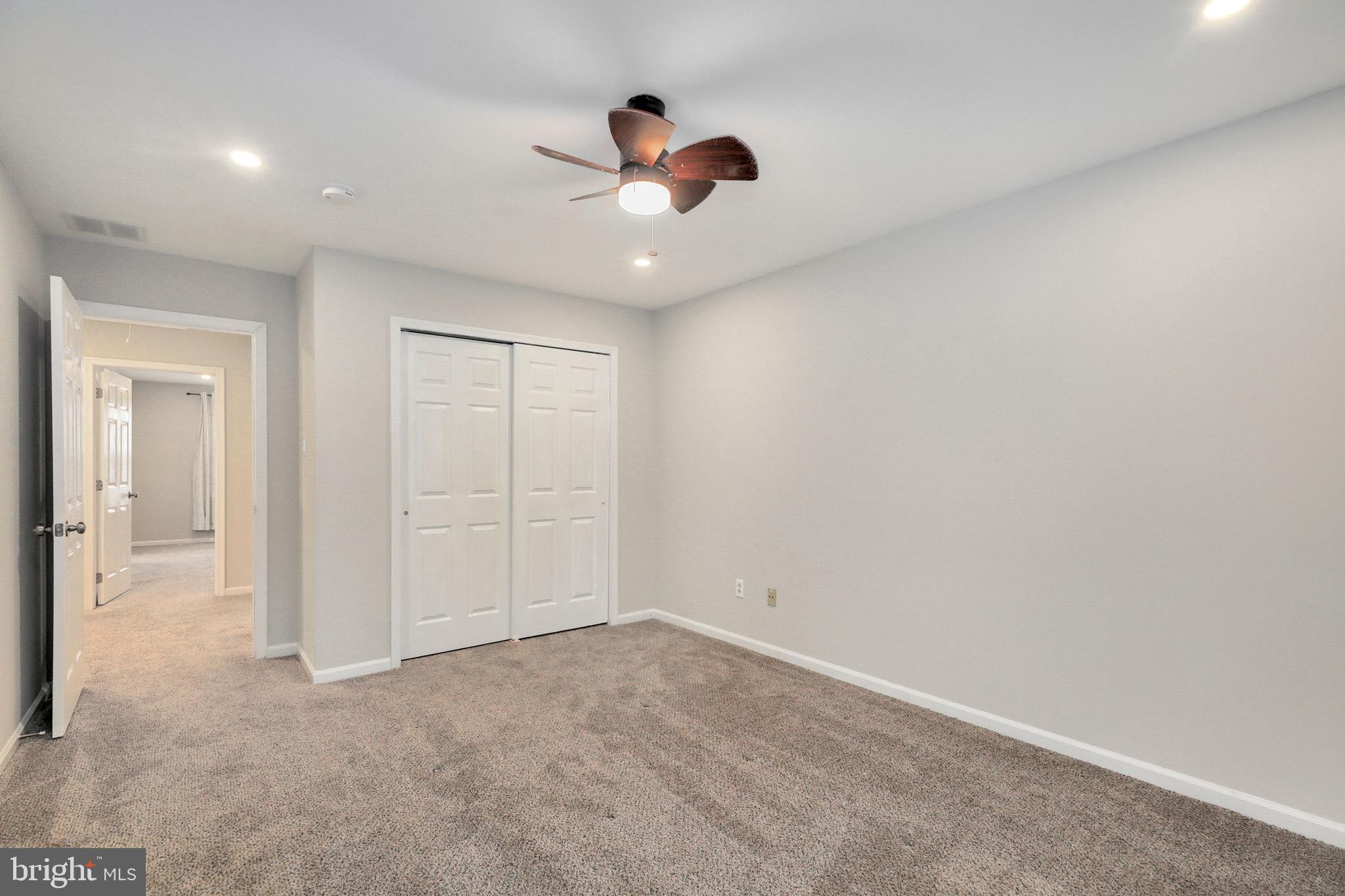 1804 Mason Run Pine Hill, NJ 08021 - Photo 21 of 32 an empty room with closet and a chandelier fan