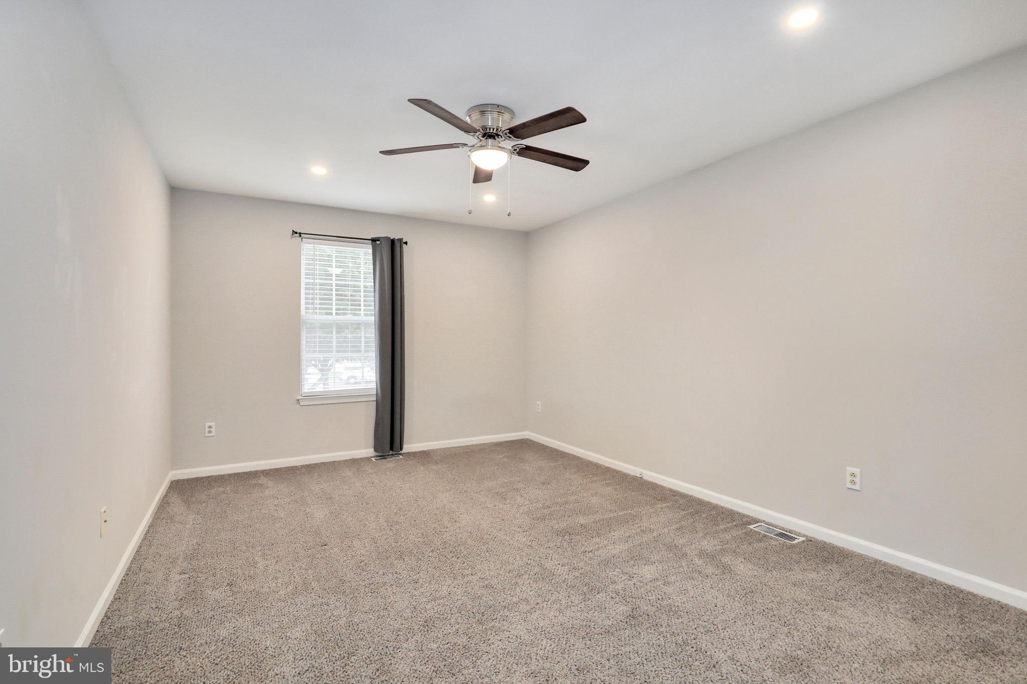 1804 Mason Run Pine Hill, NJ 08021 - Photo 22 of 32 an empty room with windows and fan