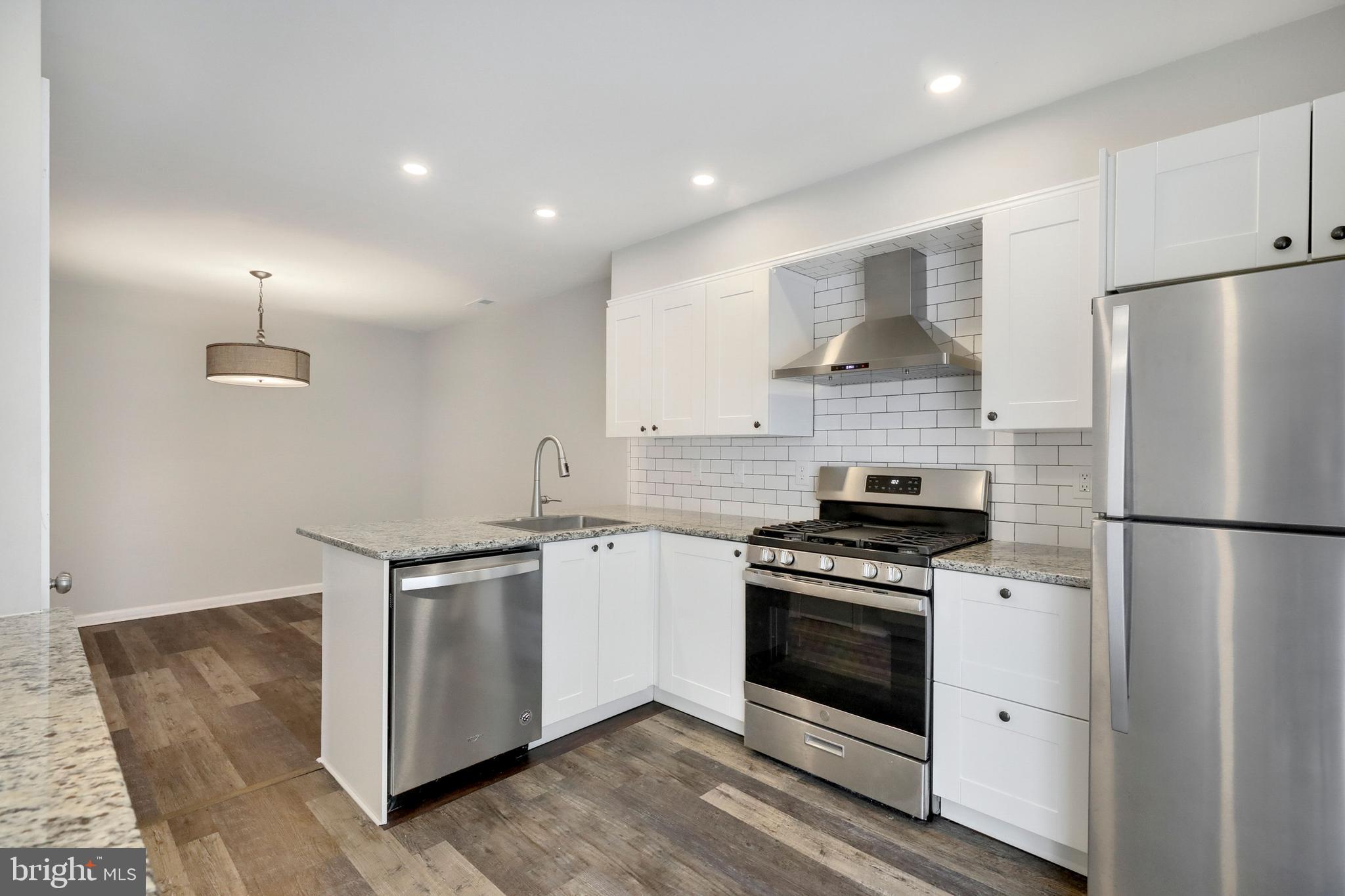 1804 Mason Run Pine Hill, NJ 08021 - Photo 3 of 32 a kitchen with white cabinets and white appliances