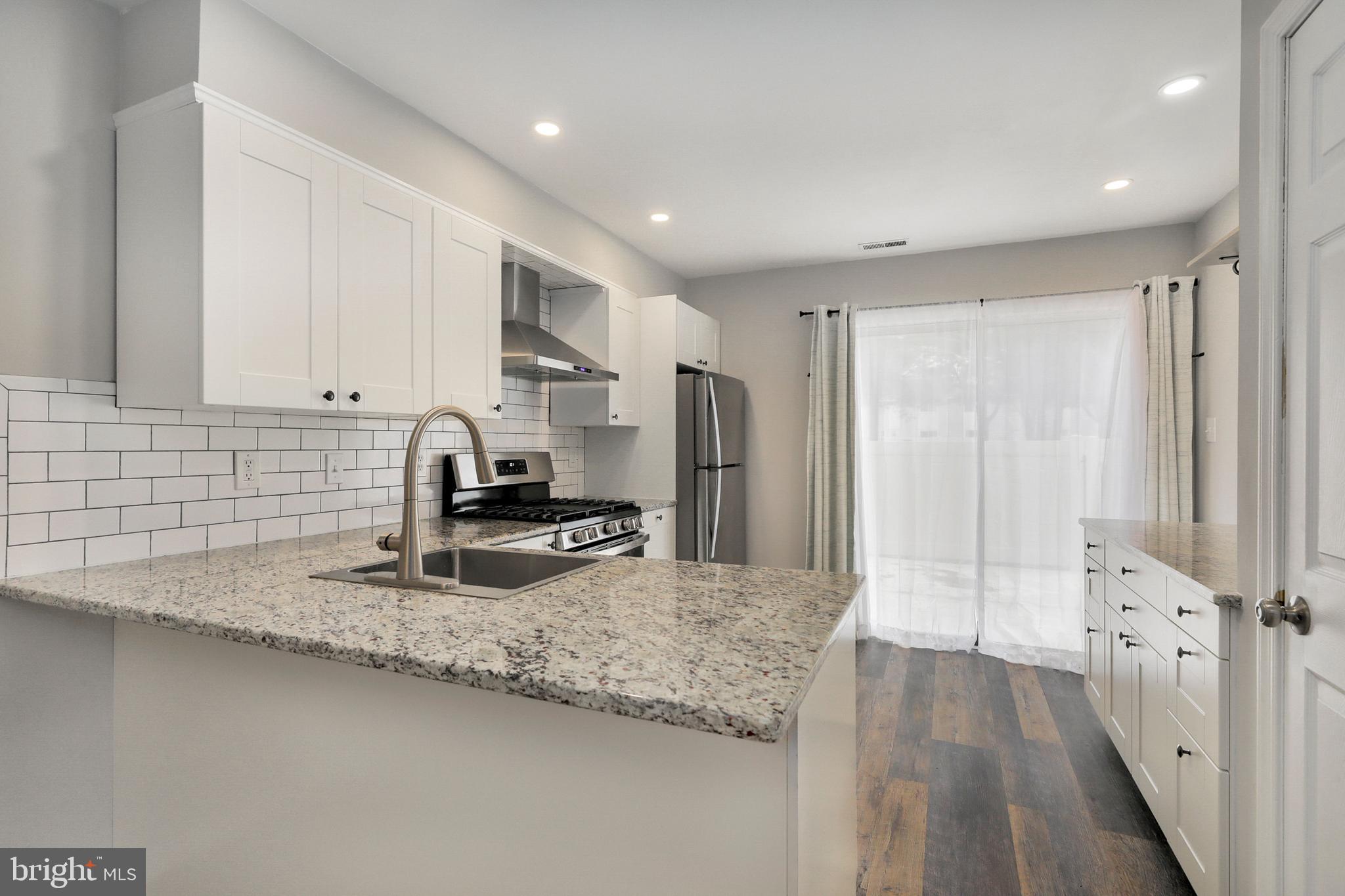 1804 Mason Run Pine Hill, NJ 08021 - Photo 5 of 32 a kitchen with sink refrigerator and microwave