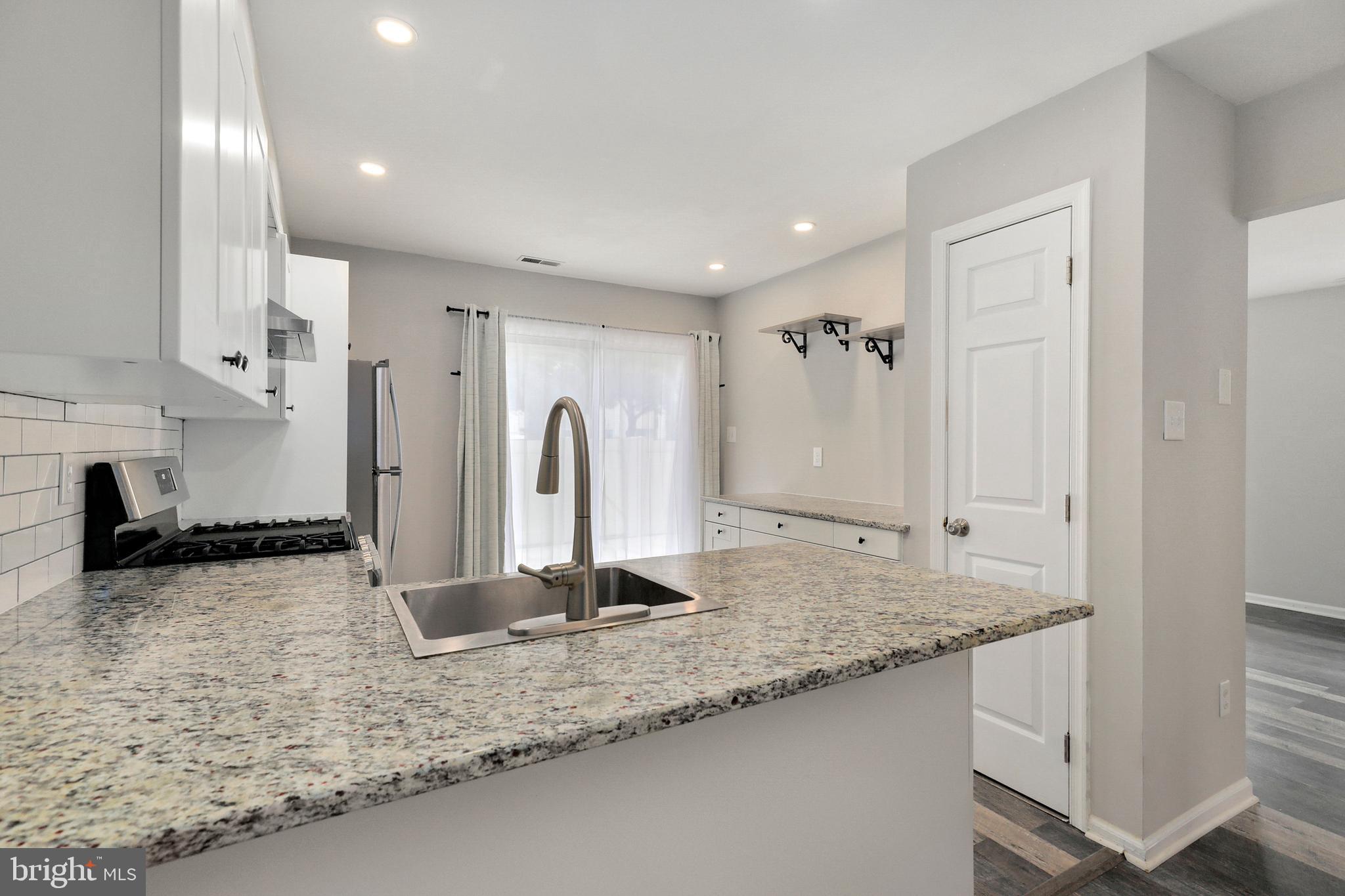 1804 Mason Run Pine Hill, NJ 08021 - Photo 6 of 32 a bathroom with a granite countertop sink and a mirror