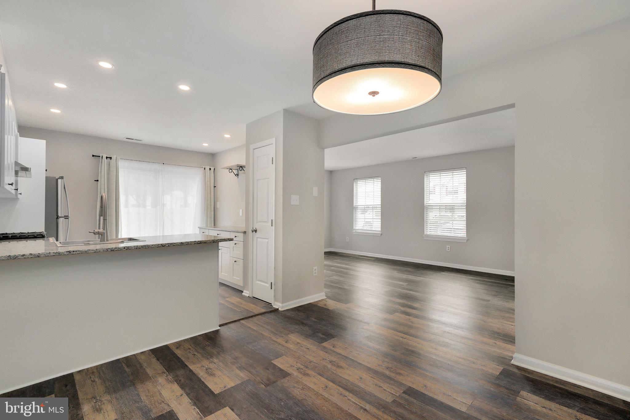 1804 Mason Run Pine Hill, NJ 08021 - Photo 7 of 32 an empty room with wooden floor and windows