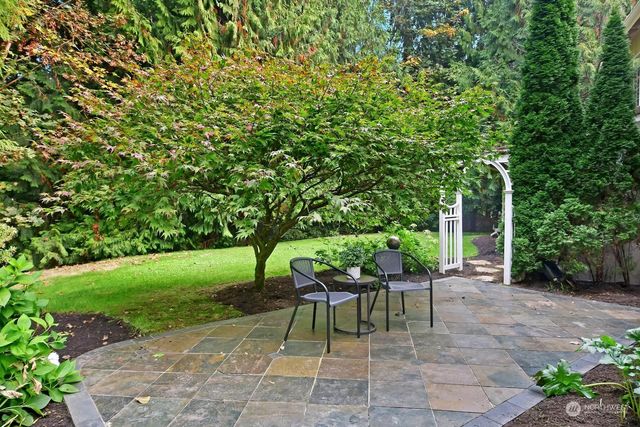 a view of a chairs and table in the garden