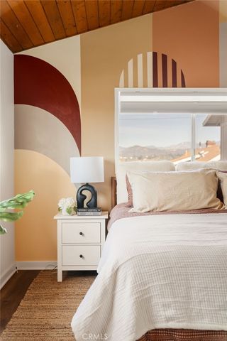 a bedroom with a bed and chair