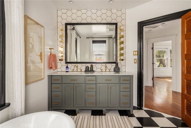 a view of a house with a yard and sitting area