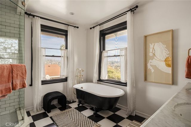 a bedroom with furniture and a window