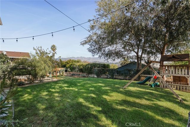 a backyard of a house with lots of green space