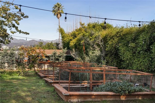 an aerial view of houses with trees