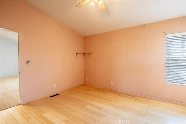a table and chairs under an umbrella