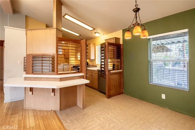 a kitchen with a sink and a refrigerator