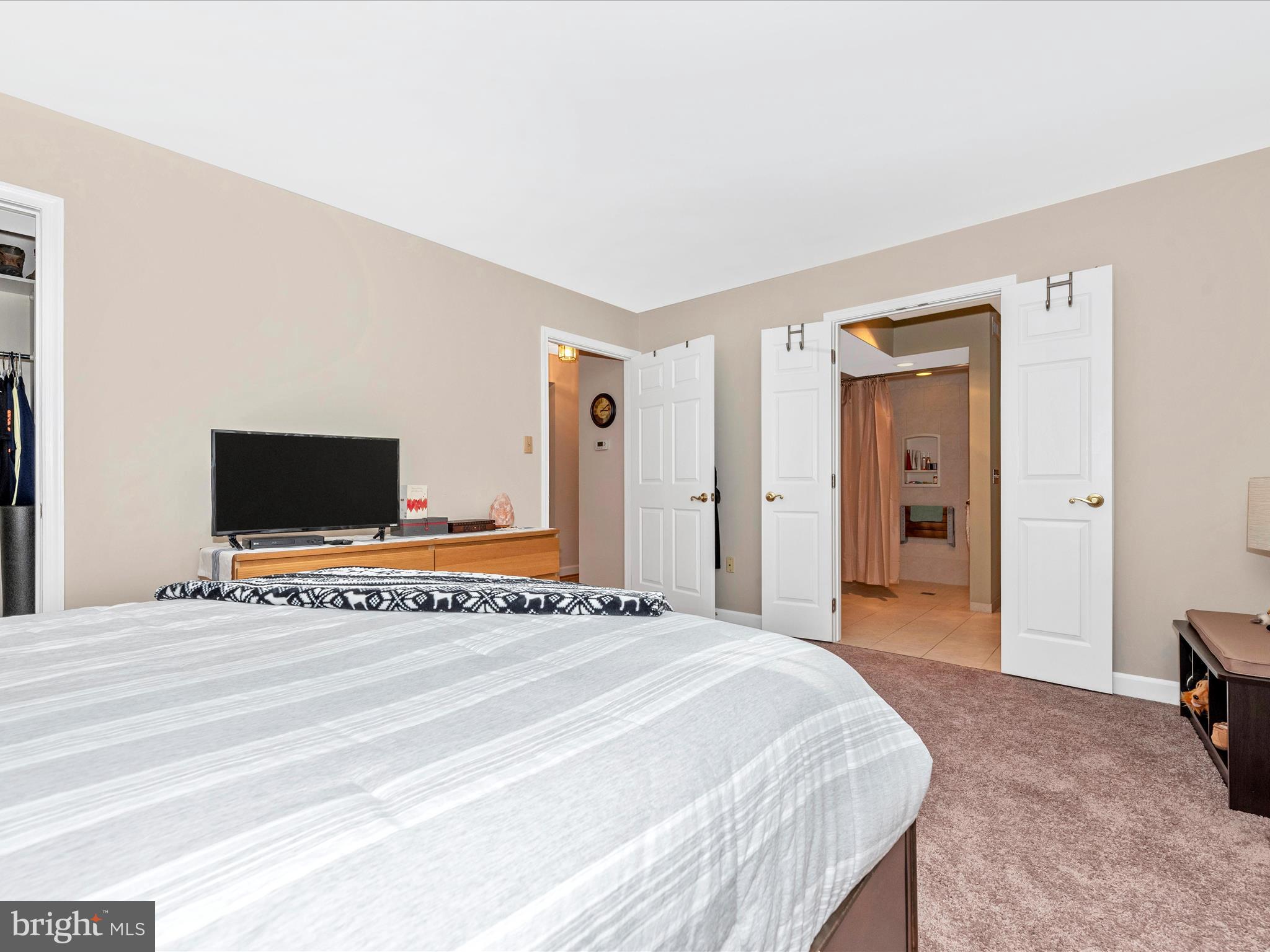 2479 Five Shillings Road Frederick, MD 21701 - Photo 21 of 52 a bedroom with a bed and a flat screen tv
