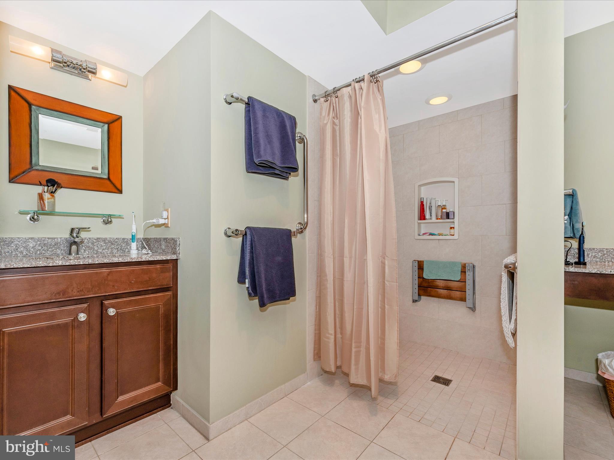2479 Five Shillings Road Frederick, MD 21701 - Photo 23 of 52 a bathroom with a sink vanity and mirror
