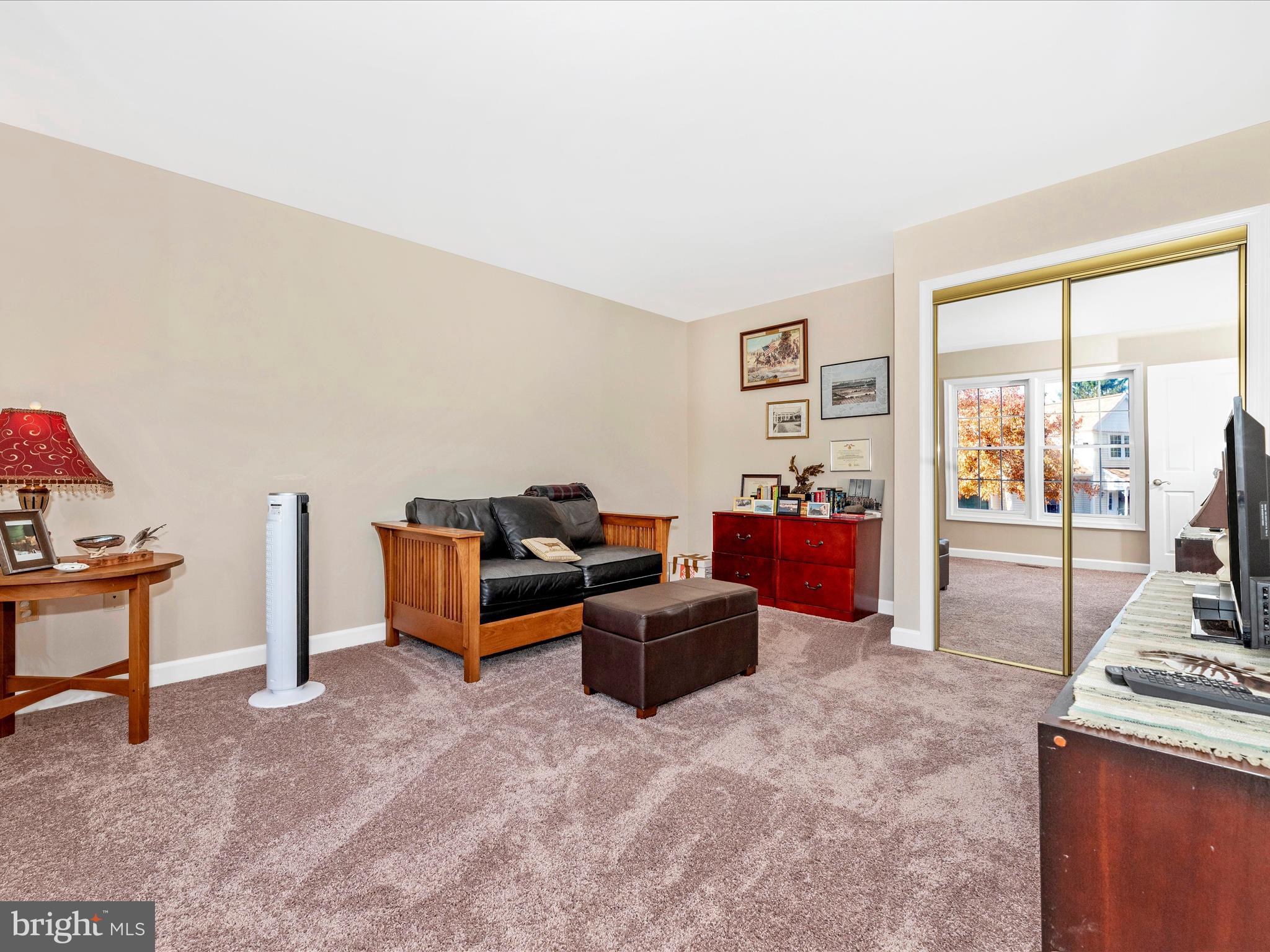 2479 Five Shillings Road Frederick, MD 21701 - Photo 28 of 52 a living room with furniture and a flat screen tv