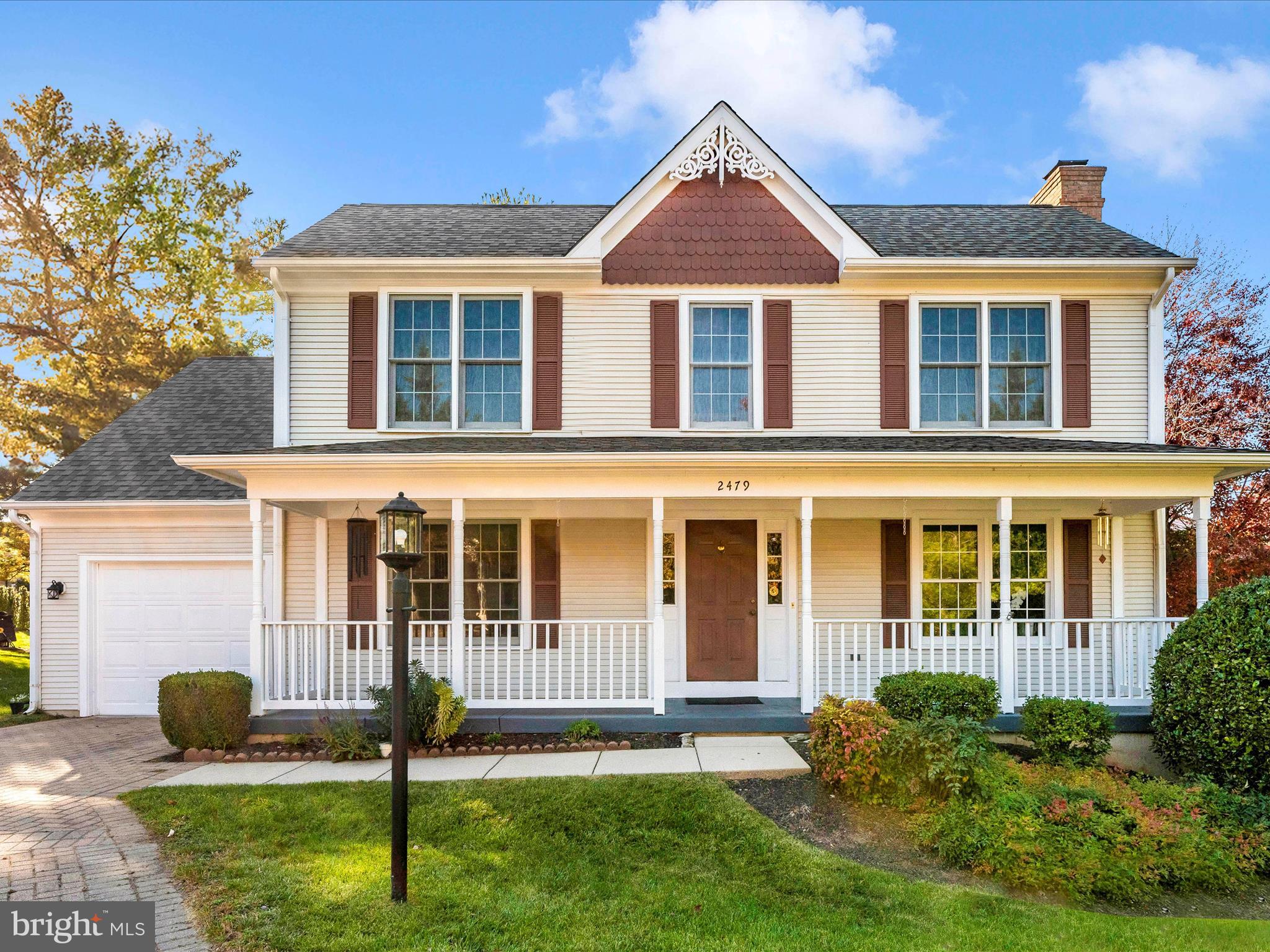 2479 Five Shillings Road Frederick, MD 21701 - Photo 3 of 52 a front view of a house with a yard