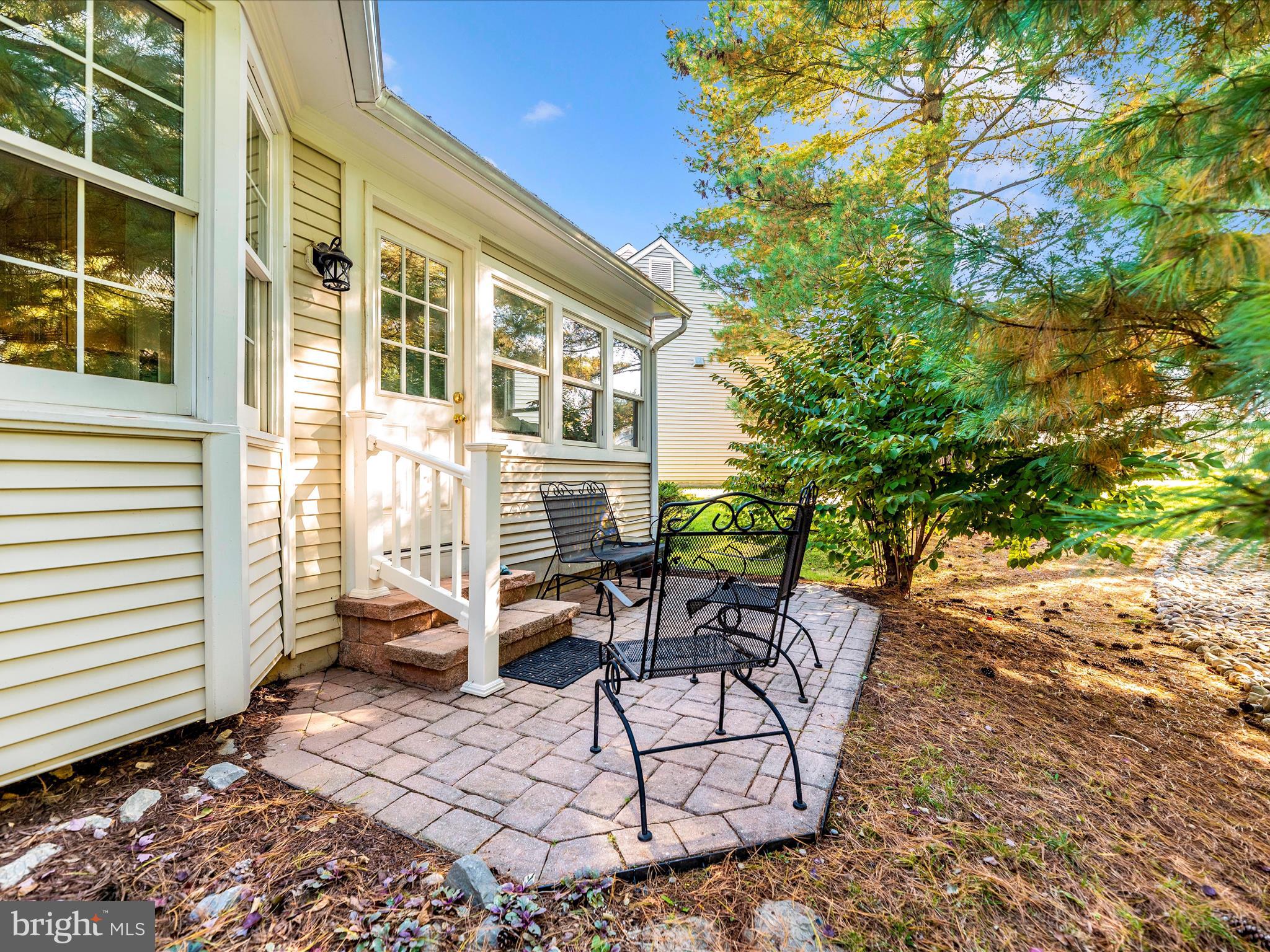 2479 Five Shillings Road Frederick, MD 21701 - Photo 39 of 52 a view of a patio with a table and chairs and potted plants