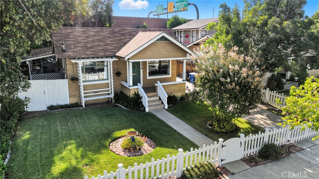 3174 Mulberry Street Riverside, CA 92501 - Photo 1 of 1 a front view of a house with garden