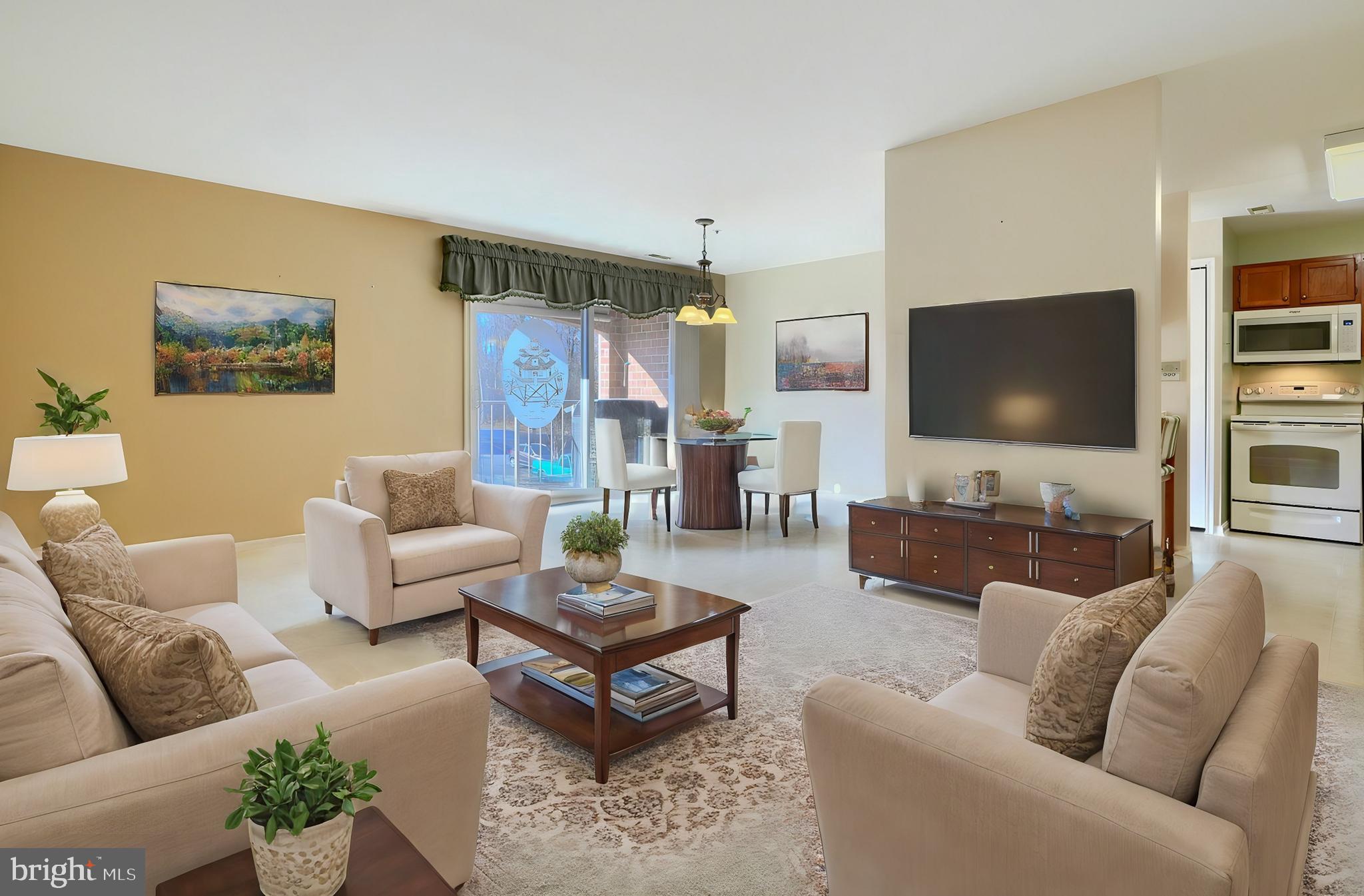 4102 Chardel Road, Unit 2H Nottingham, MD 21236 - Photo 2 of 21 a living room with furniture and a flat screen tv