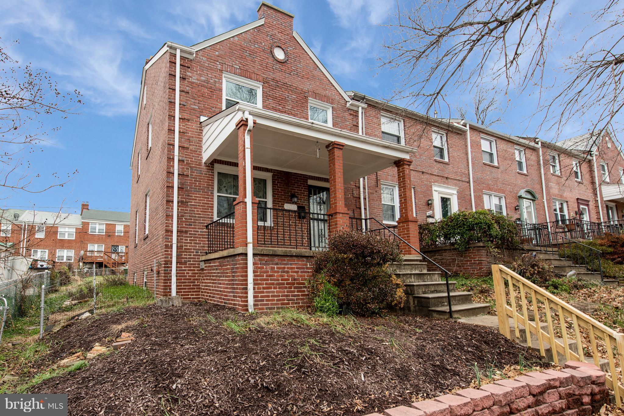 a view of a house with brick walls