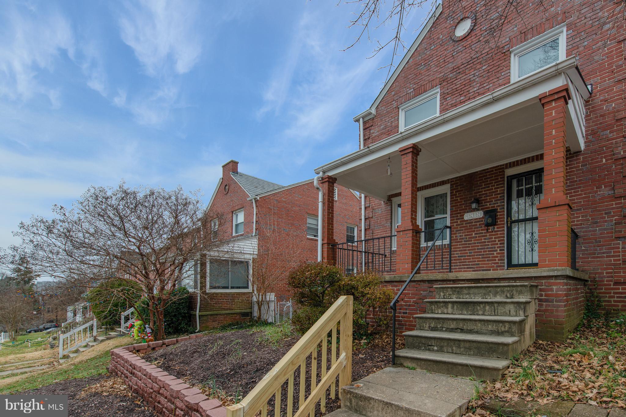 3818 Rexmere Road Baltimore, MD 21218 - Photo 2 of 25 a front view of a house with a yard