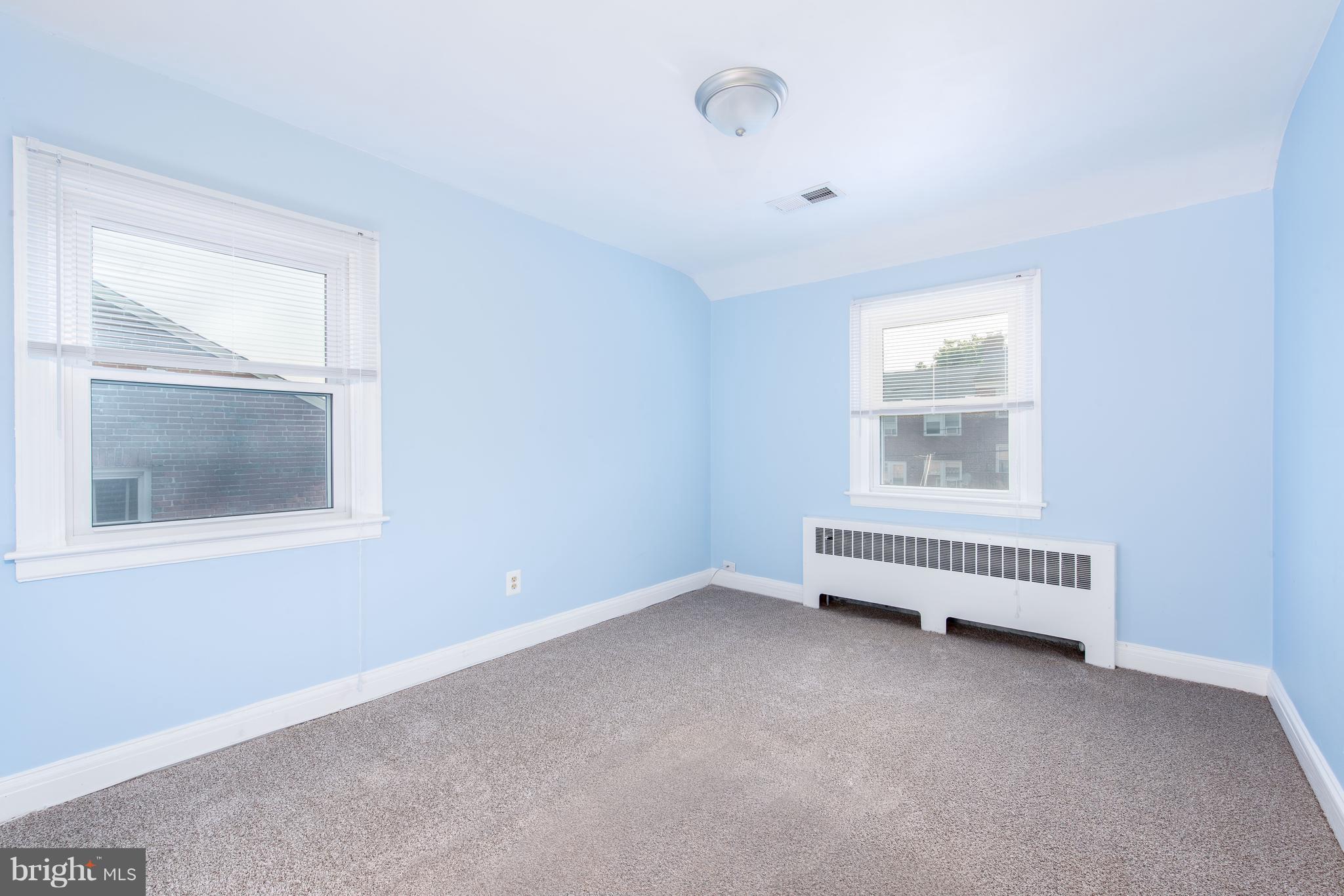 3818 Rexmere Road Baltimore, MD 21218 - Photo 10 of 25 an empty room with windows