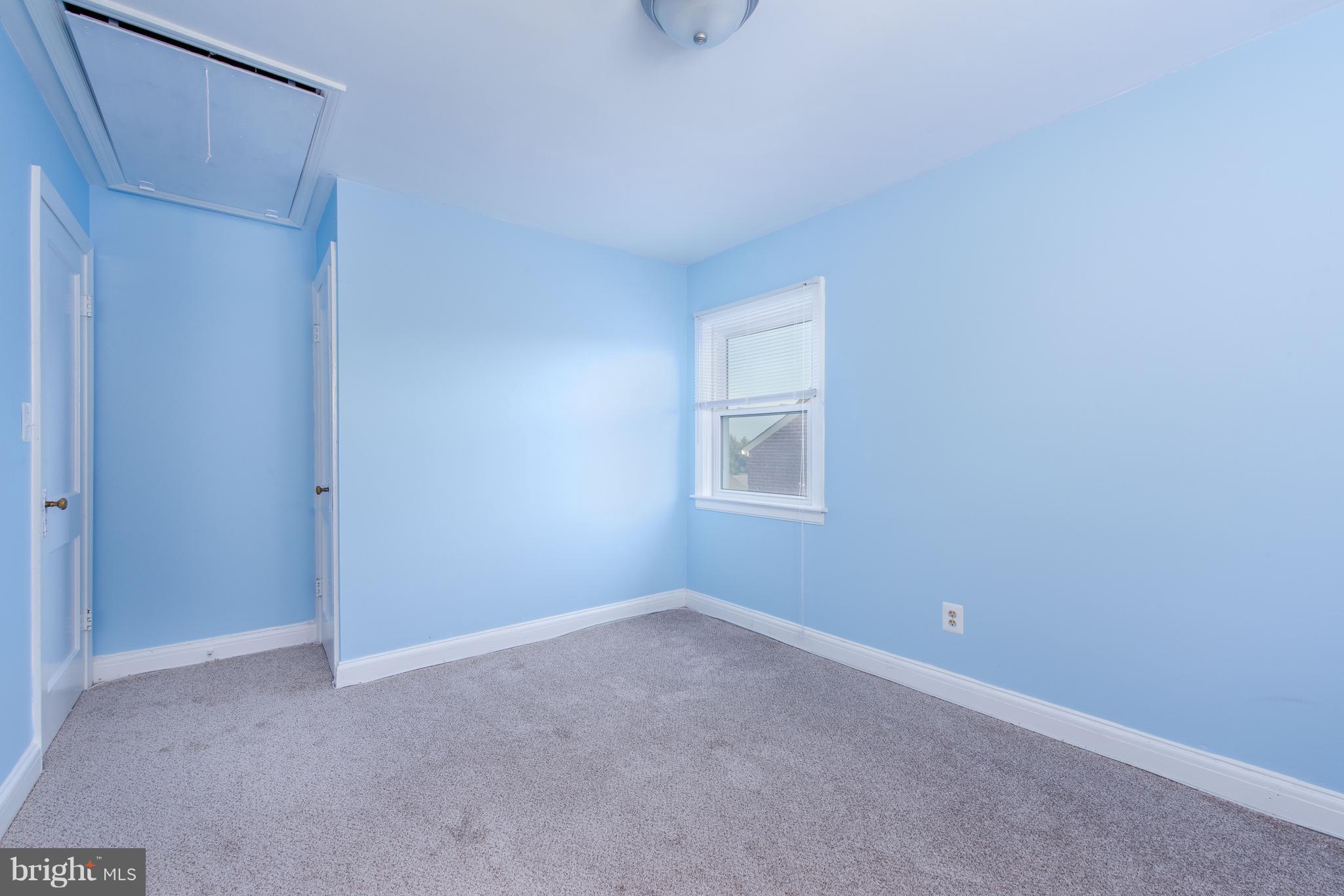 3818 Rexmere Road Baltimore, MD 21218 - Photo 11 of 25 a view of an empty room with windows