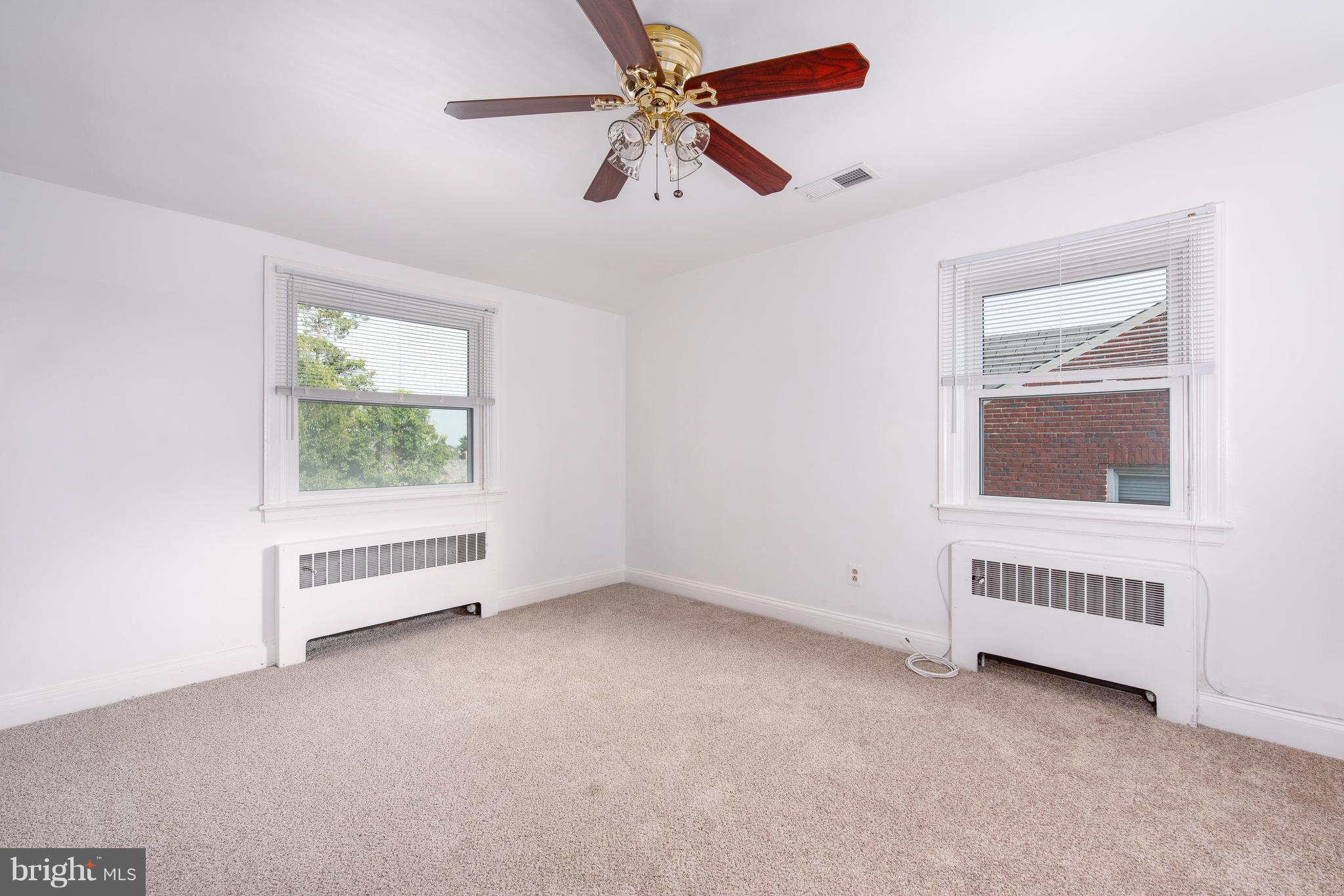 3818 Rexmere Road Baltimore, MD 21218 - Photo 13 of 25 an empty room with windows