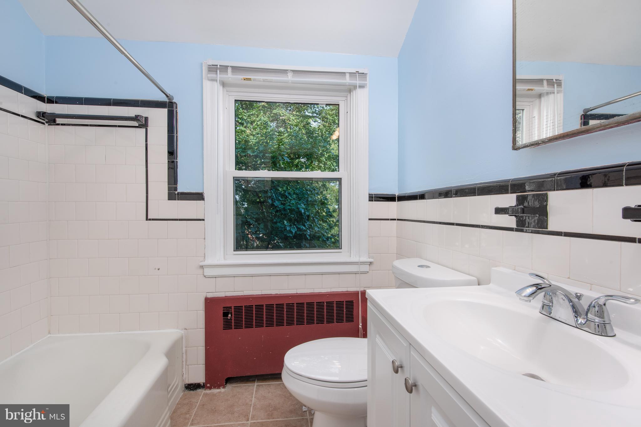 3818 Rexmere Road Baltimore, MD 21218 - Photo 15 of 25 a bathroom with a sink a toilet and a bathtub