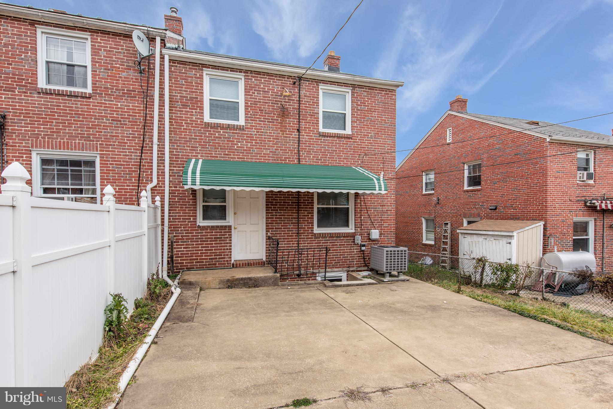 3818 Rexmere Road Baltimore, MD 21218 - Photo 3 of 25 a front view of a house with a yard