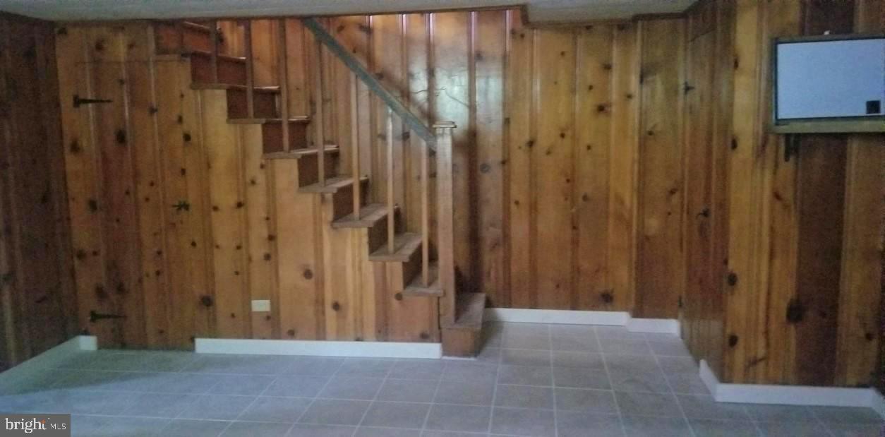 3818 Rexmere Road Baltimore, MD 21218 - Photo 21 of 25 a view of a hallway with wooden walls