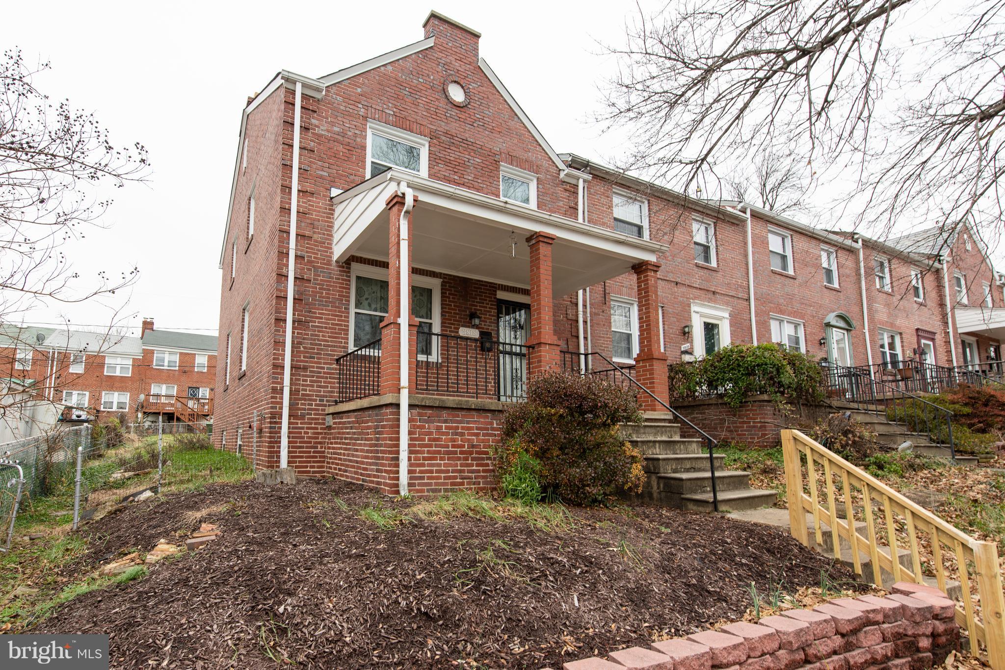 3818 Rexmere Road Baltimore, MD 21218 - Photo 23 of 25 a view of a house with a yard