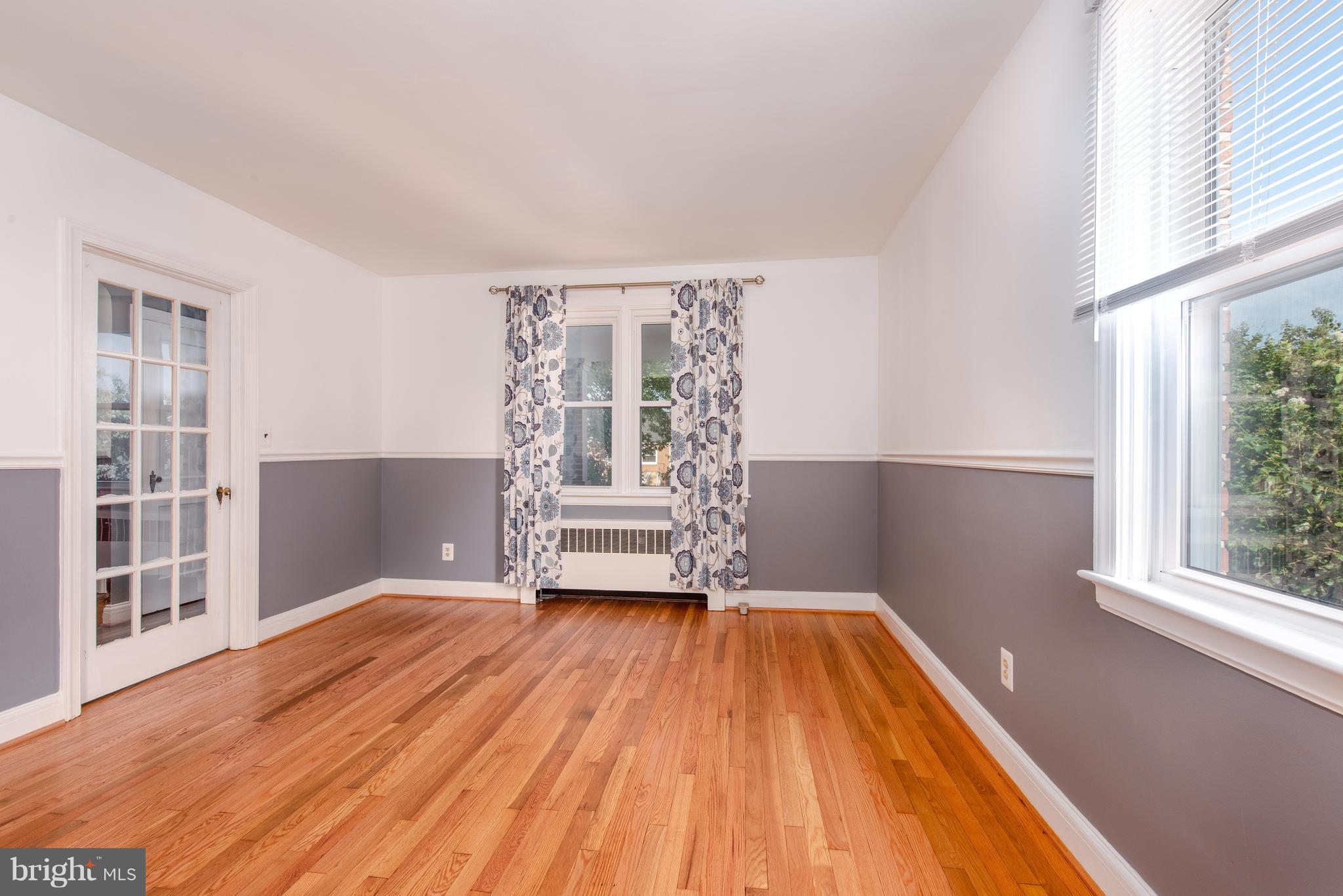 3818 Rexmere Road Baltimore, MD 21218 - Photo 5 of 25 a view of empty room with wooden floor and fan