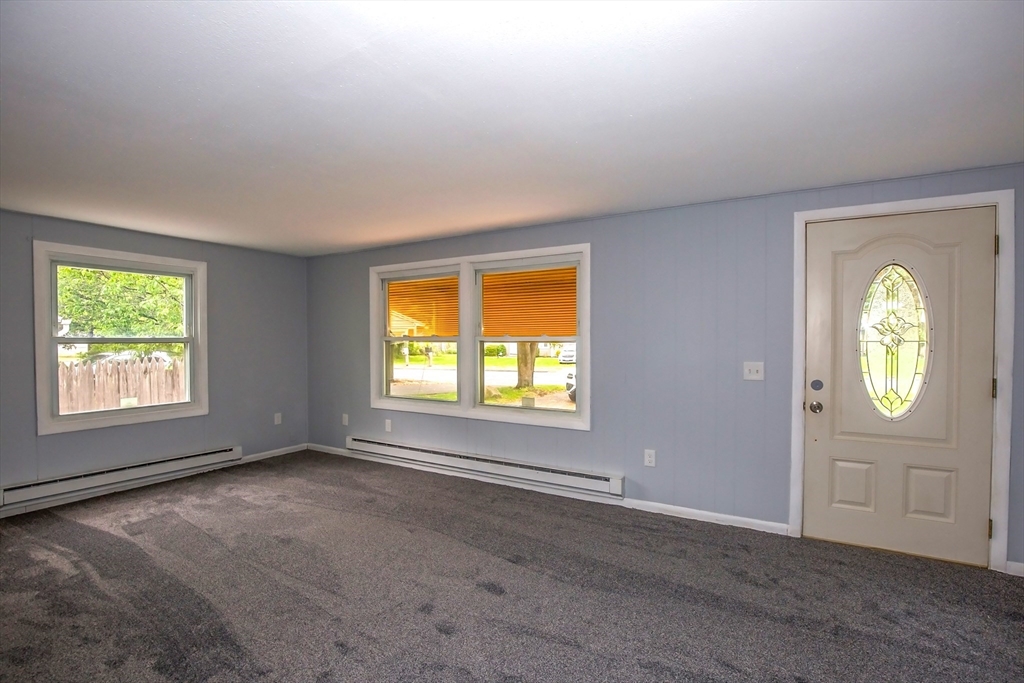 1101 Allen Street Springfield, MA 01118 - Photo 12 of 29 an empty room with windows and mirror