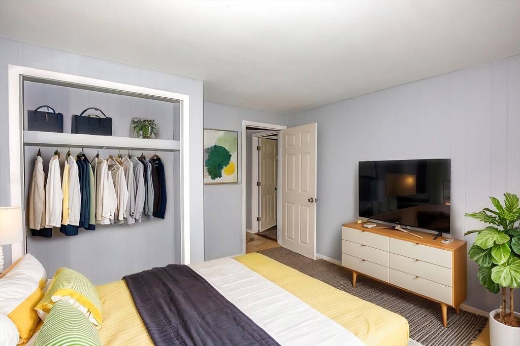 1101 Allen Street Springfield, MA 01118 - Photo 15 of 29 a bedroom with a bed and a flat screen tv