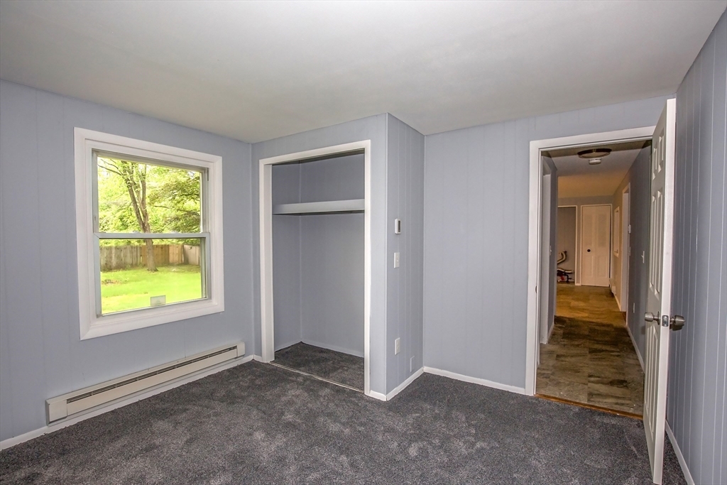 1101 Allen Street Springfield, MA 01118 - Photo 17 of 29 an empty room with windows and closet