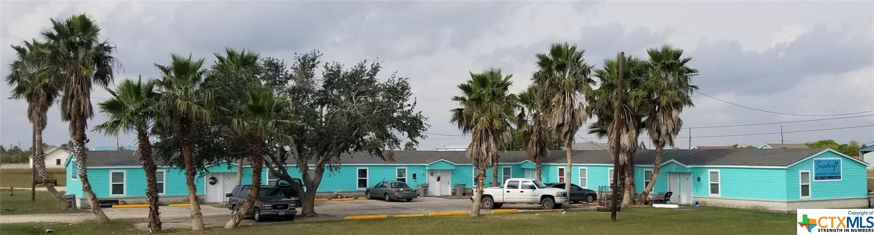 1310 West Broadway Avenue Seadrift, TX 77983 - Photo 1 of 7 a front view of a house with garden and trees