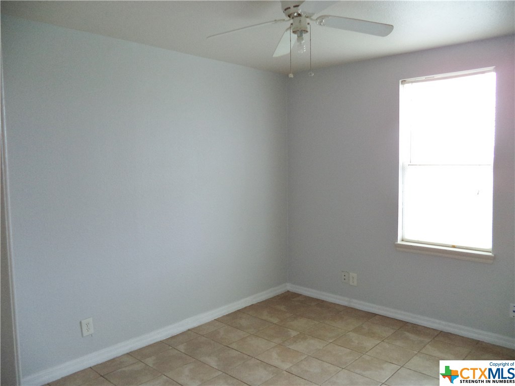 1310 West Broadway Avenue Seadrift, TX 77983 - Photo 6 of 7 an empty room with a window