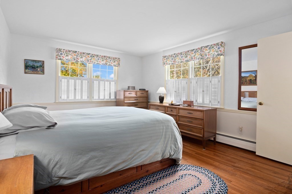 7 Hanover Drive Newbury, MA 01951 - Photo 14 of 33 a bedroom with a bed and a desk