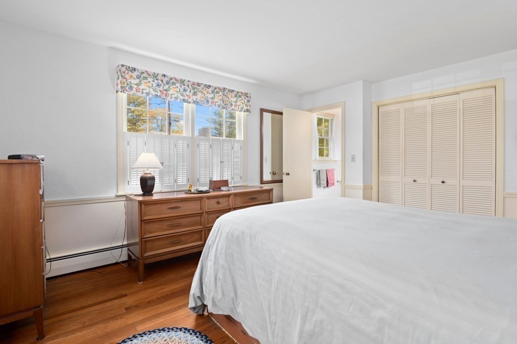 7 Hanover Drive Newbury, MA 01951 - Photo 15 of 33 a bedroom with a bed and a large window