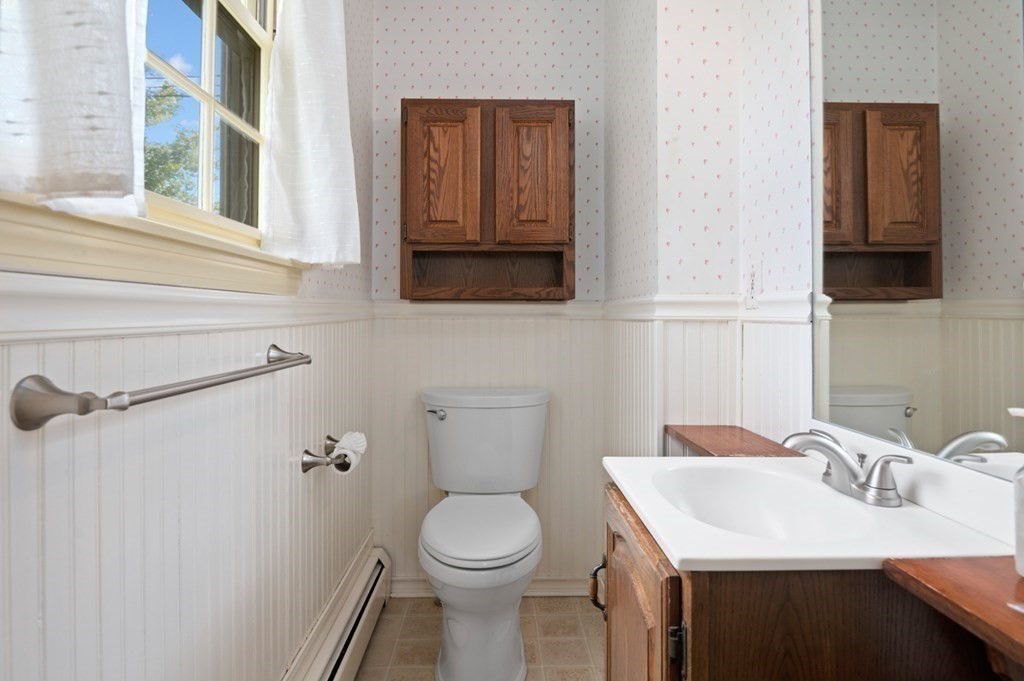 7 Hanover Drive Newbury, MA 01951 - Photo 16 of 33 a bathroom with a sink a toilet and mirror