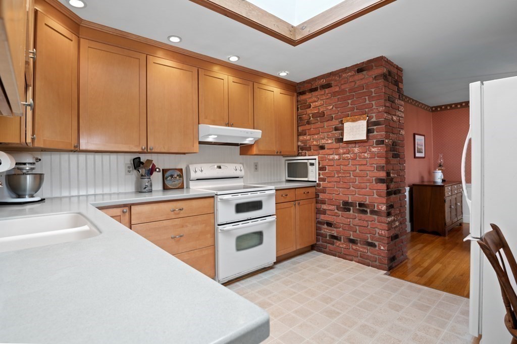 7 Hanover Drive Newbury, MA 01951 - Photo 7 of 33 a kitchen with stainless steel appliances a stove a sink and a refrigerator