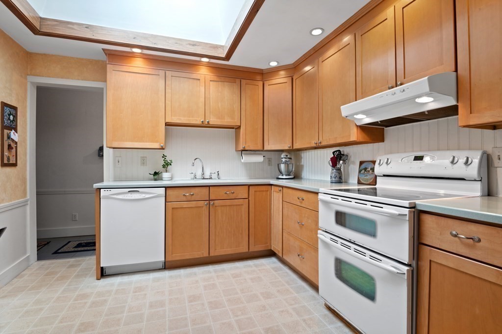 7 Hanover Drive Newbury, MA 01951 - Photo 9 of 33 a kitchen with a sink cabinets and appliances