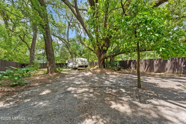 a view of outdoor space with deck and tree