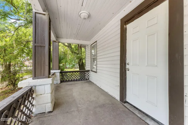 a view of a porch with wooden floor and outdoor space