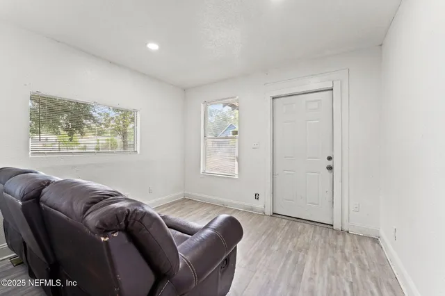 a living room with furniture and a window